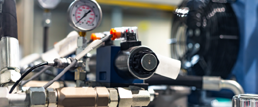 Engineer reviewing Tolomatic actuator application information for sizing and selection